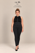 A woman modeling a black sleeveless top and black leggings set against a plain beige studio background. Text at the top reads 'UK 16 (XL) APPLE SHAPE FULLER ABDOMEN'.